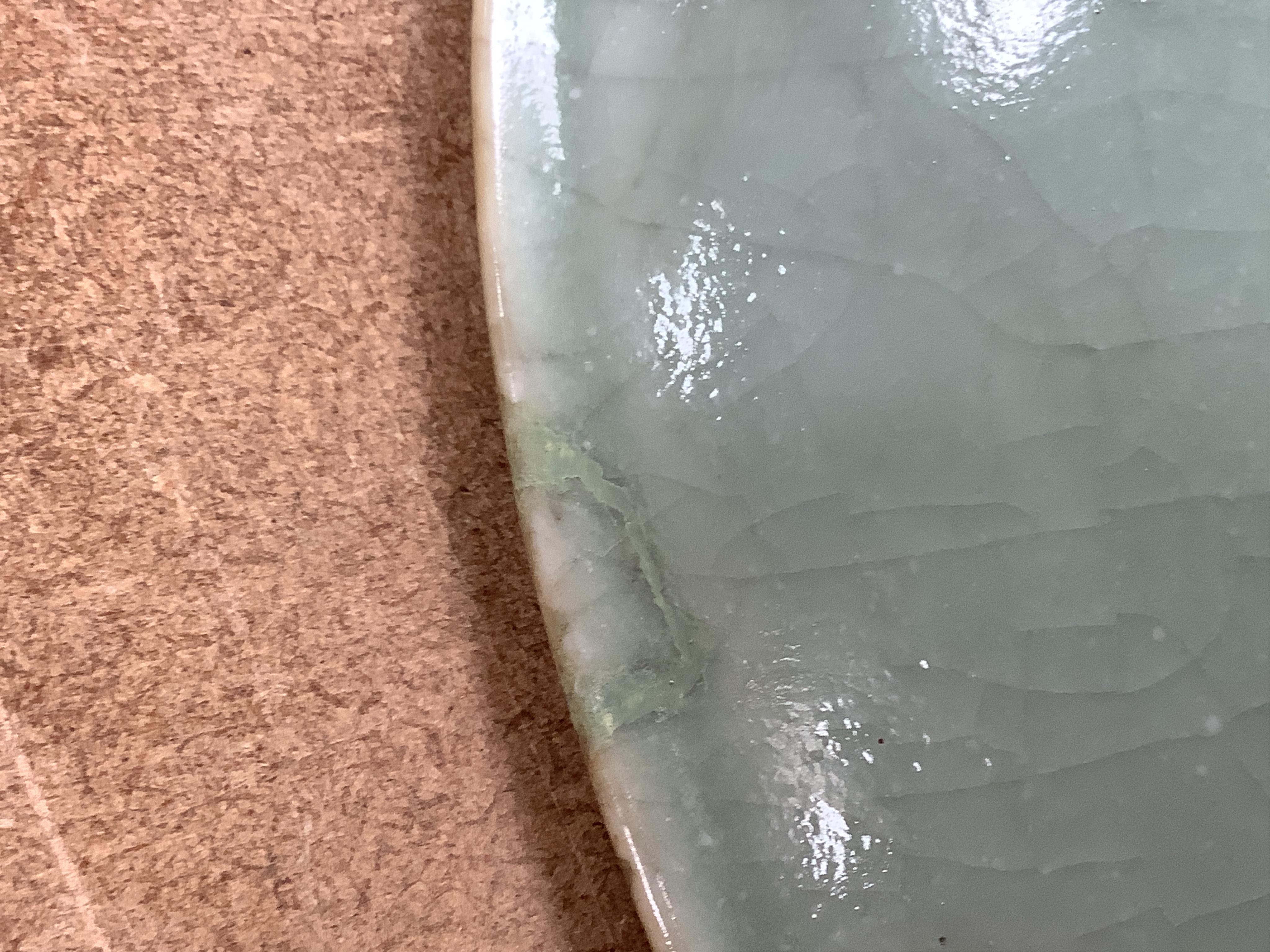 A Chinese celadon glazed dish, late Qing, 34cm in diameter